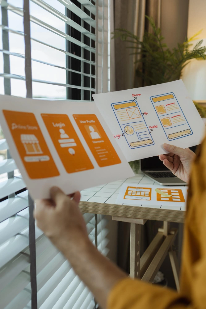 Designers working on AI-enhanced UX/UI interfaces in a nearshore office