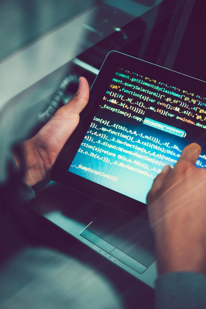 Developers collaborating on nearshore software project using AI tools to streamline code creation