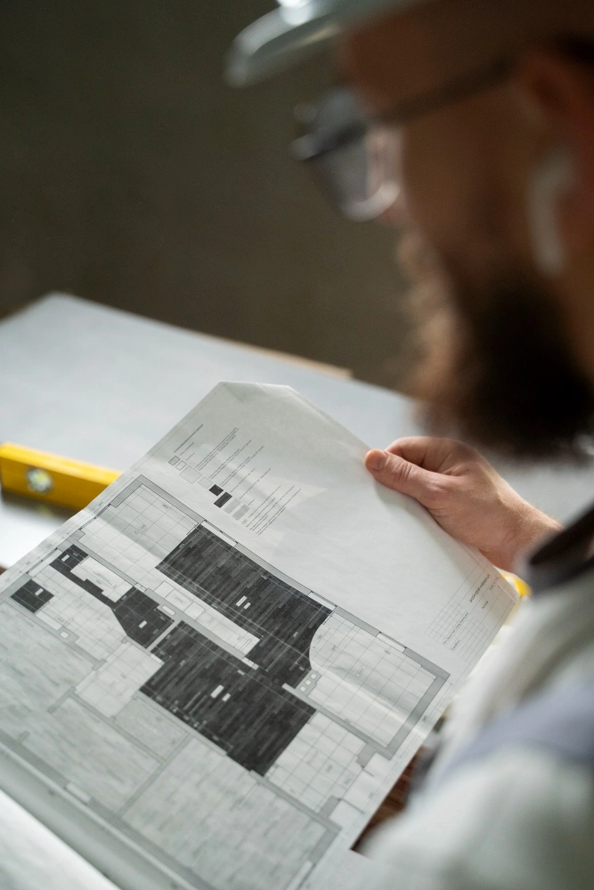 Construction estimator using AI software to calculate materials and costs on digital plans