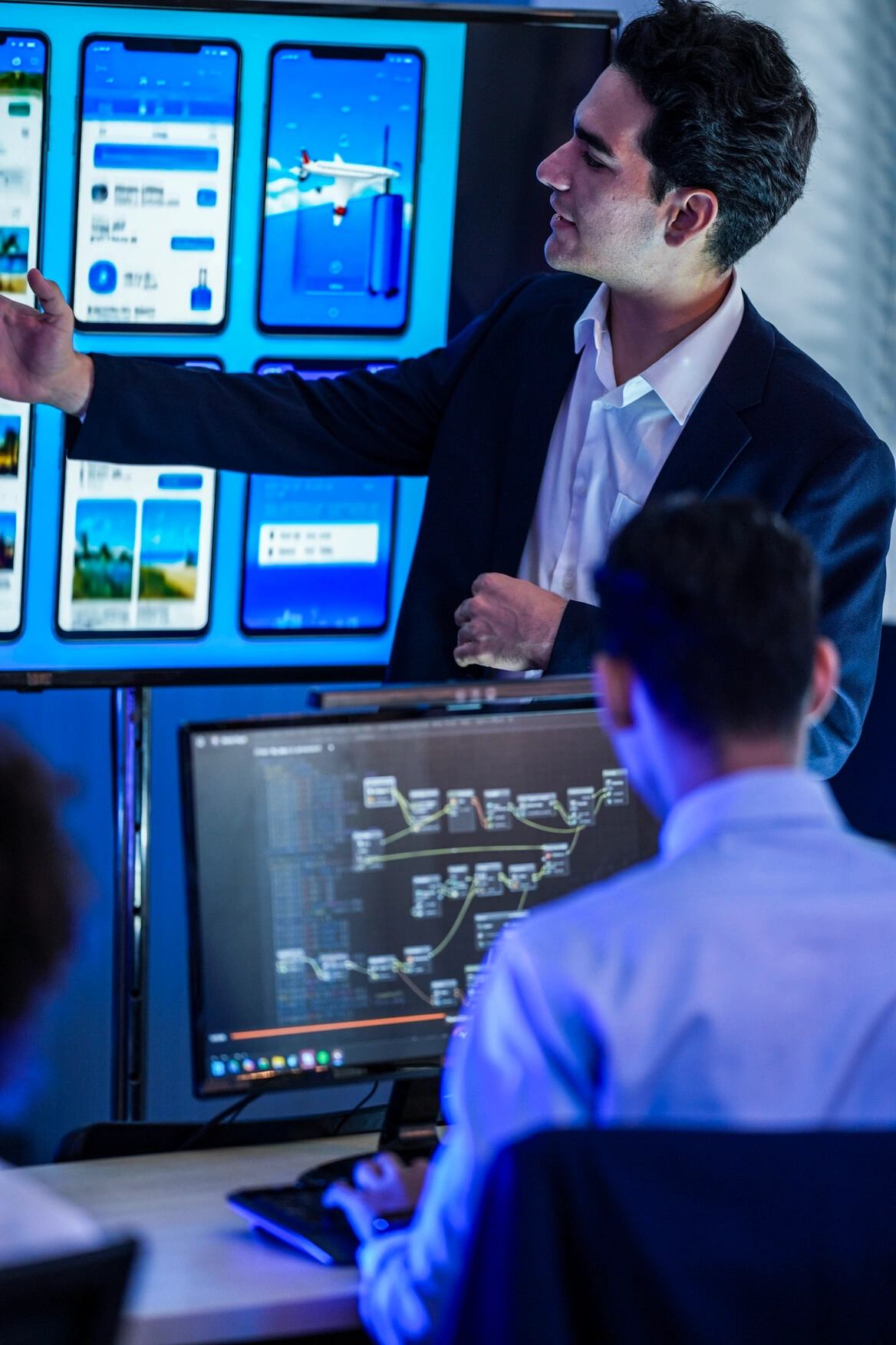 Product designers and software engineers collaborating on AI integration workflows, backend systems, and user experience architecture
