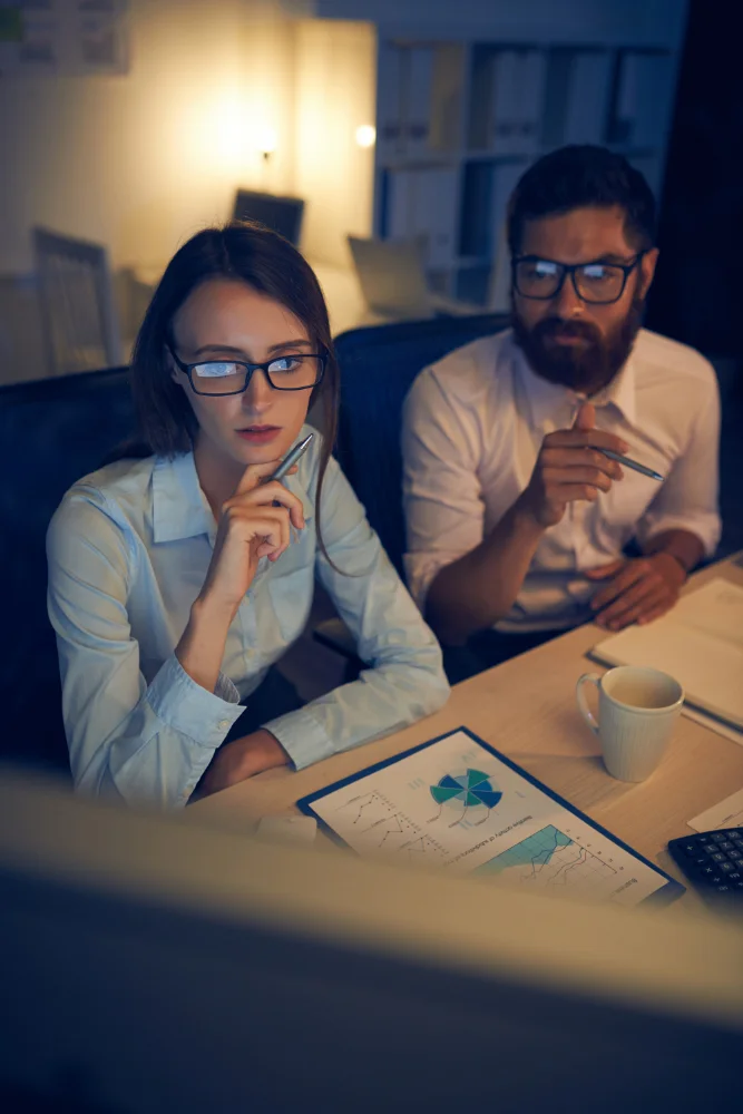 Enterprise technology team reviewing Microsoft Copilot style AI agents connected to business applications, APIs, cloud systems, and company data