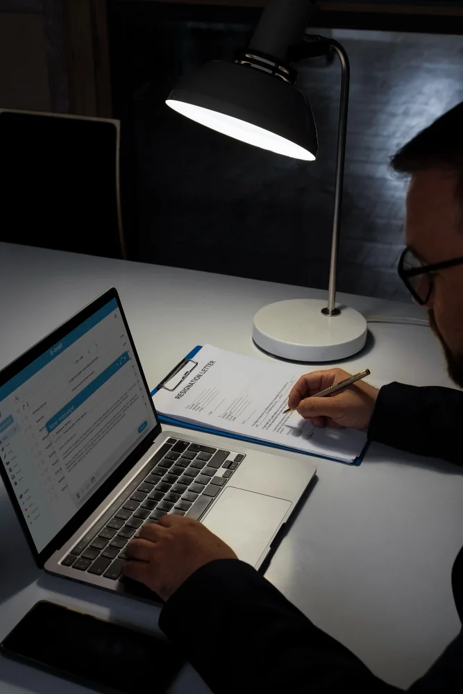 Financial technology professionals reviewing transaction monitoring dashboards, data governance controls, and automated compliance workflows in a modern office.